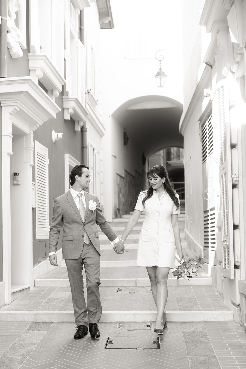 the couple is walking in the street